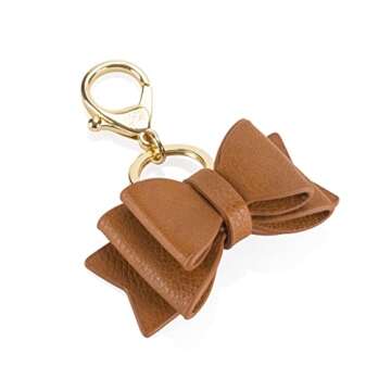 Itzy Ritzy Boss Bow Charm with Clasp - Cute Bow Bag Charm for Diaper Bags, Purses, Keychains & Wallets - Versatile & Stylish Vegan Leather Purse Charm (Cognac)