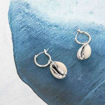 Columbus Rhodium Plated Cowrie Charm Huggie Hoop Earrings - Shell Earrings - Cowry Shell Dangle Earrings - Charm Huggies for Women (Silver Cowry Shell)