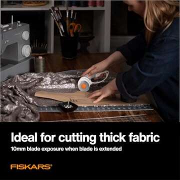 Fiskars 60mm Rotary Cutter for Fabric with Ergonomic Loop Grip And Comfort Handle, Titanium Rotary Fabric Cutter for Thick Materials, Easy and Safe Blade Change, Sewing Supplies and Quilting Tools