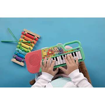 CoComelon First Act Musical Keyboard, 23 Keys; Music and ABC Songs Pre-Recorded, Educational Music Toys, Carry N’ Go Handle