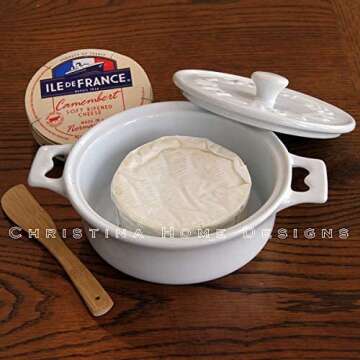 White Camembert Baker and Brie Baker with Cookbook. Brie Cooker comes with Spatula, Lid, Base and Cookbook. Brie Baking Dish is Microwave, Dishwasher and Oven Safe by Christina Home Designs.