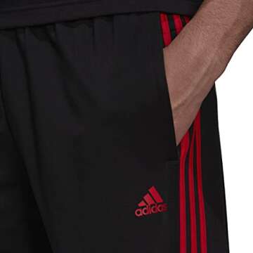 adidas Men's Essentials Warm-up Open Hem 3-stripes Tracksuit Bottoms, Black/Scarlet, X-Small/31" Inseam