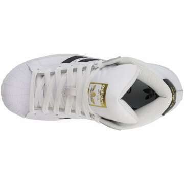 adidas Originals unisex-child Pro Model Sneaker , White/Black/Gold Foil , 4.5 Big Kid